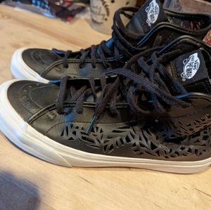 Very unique pair of cut out Vans high tops.